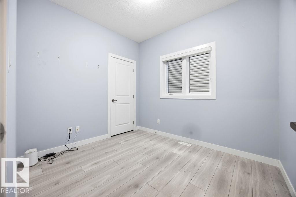 1057 Coopers Hawk Link, Edmonton, AB - Indoor Photo Showing Other Room
