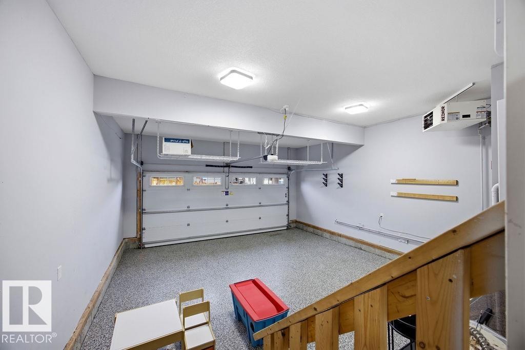 1057 Coopers Hawk Link, Edmonton, AB - Indoor Photo Showing Garage