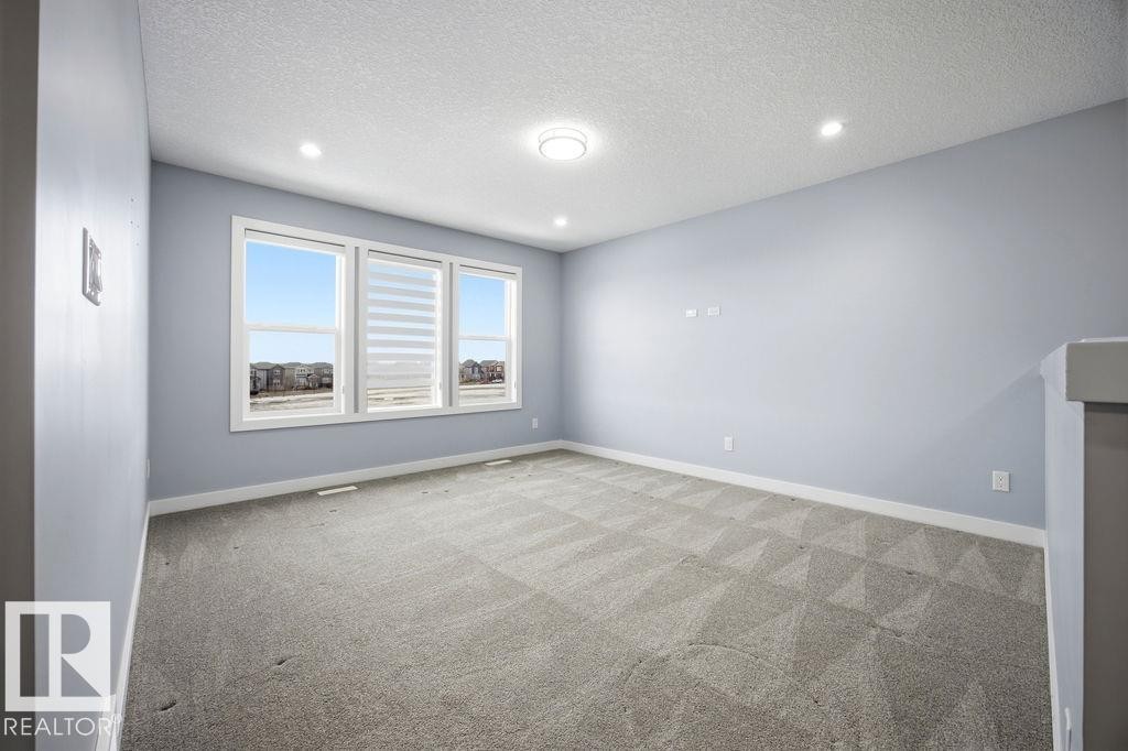1057 Coopers Hawk Link, Edmonton, AB - Indoor Photo Showing Other Room