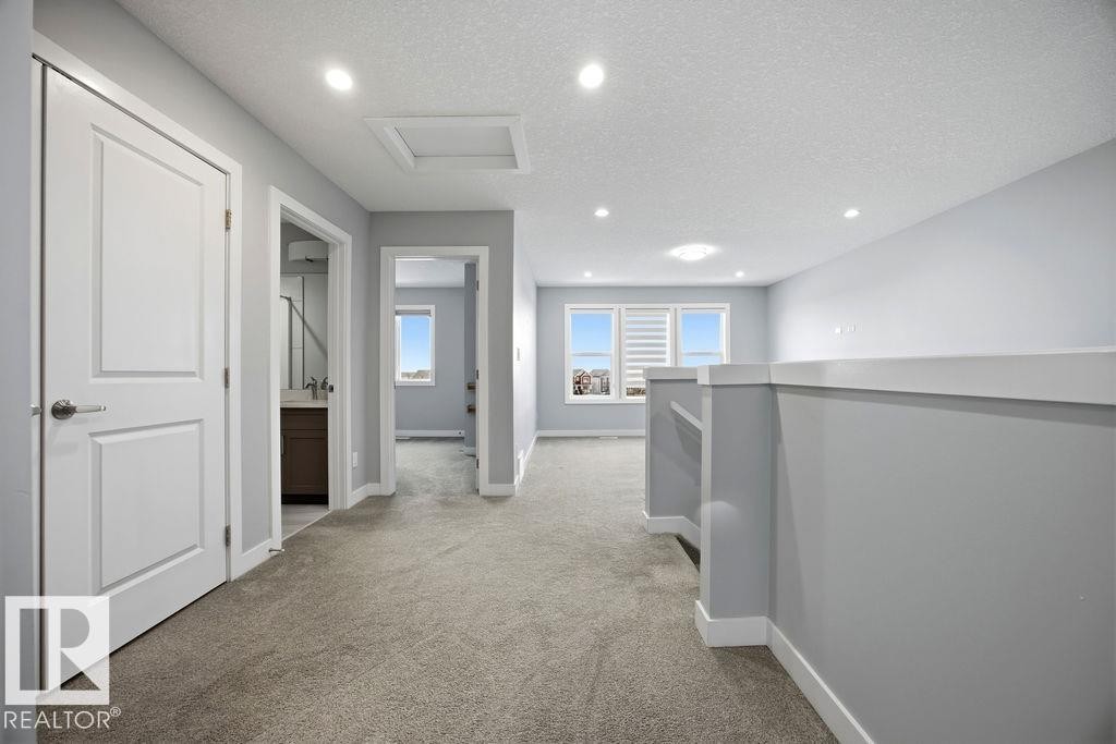 1057 Coopers Hawk Link, Edmonton, AB - Indoor Photo Showing Other Room