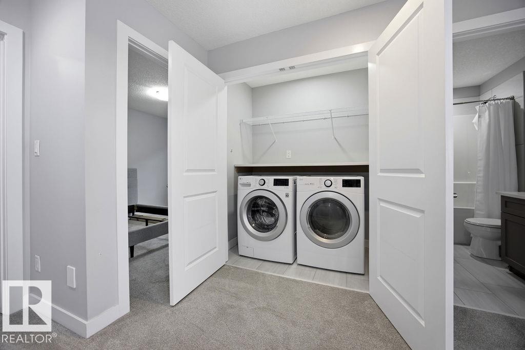 1057 Coopers Hawk Link, Edmonton, AB - Indoor Photo Showing Laundry Room