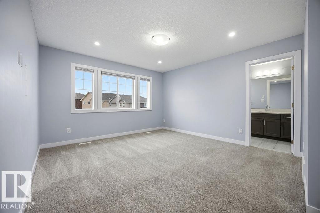 1057 Coopers Hawk Link, Edmonton, AB - Indoor Photo Showing Other Room