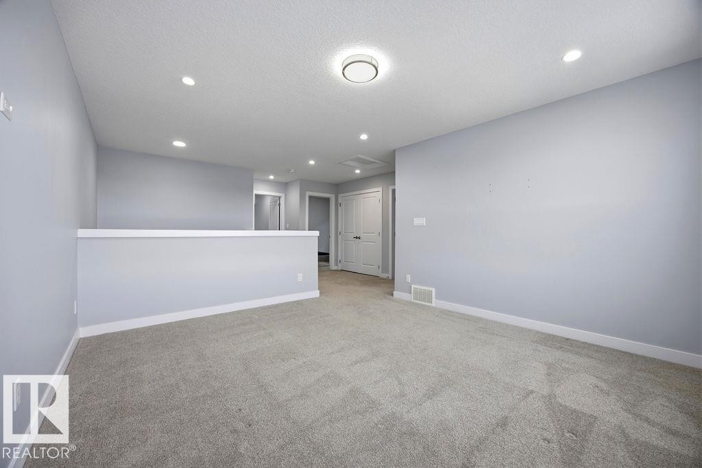 1057 Coopers Hawk Link, Edmonton, AB - Indoor Photo Showing Other Room