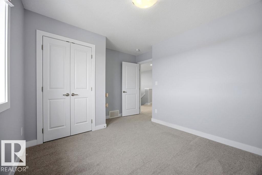 1057 Coopers Hawk Link, Edmonton, AB - Indoor Photo Showing Other Room