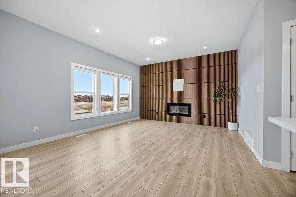 1057 Coopers Hawk Link, Edmonton, AB - Indoor With Fireplace