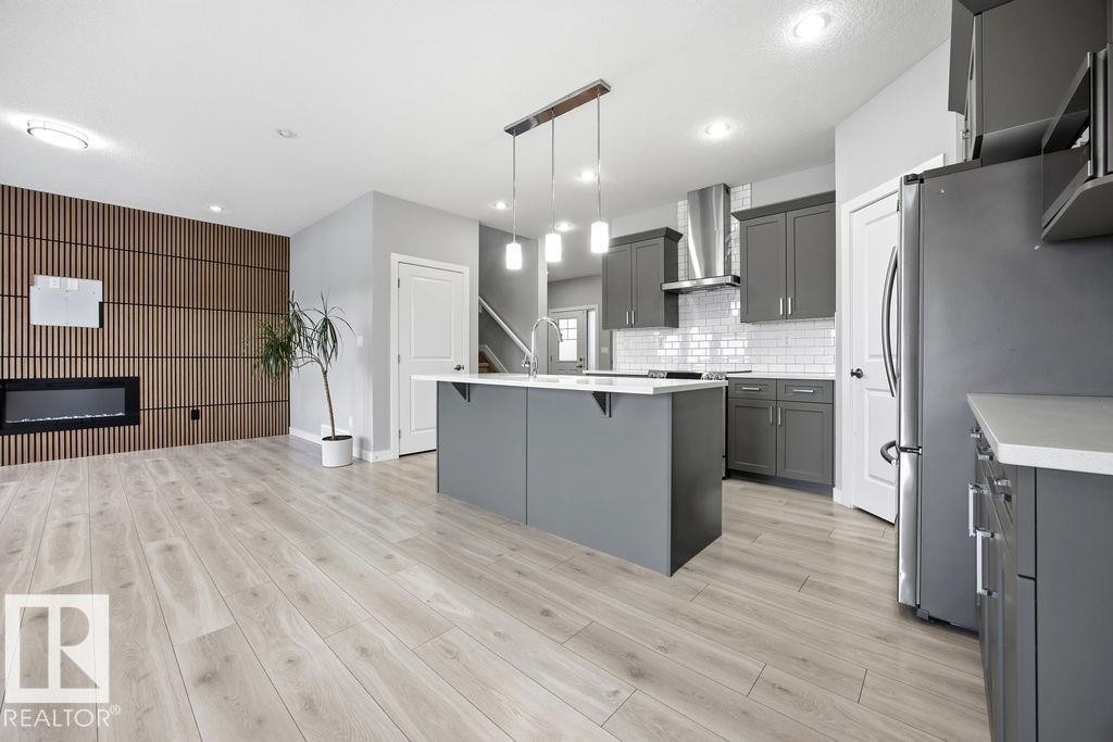 1057 Coopers Hawk Link, Edmonton, AB - Indoor Photo Showing Kitchen With Upgraded Kitchen