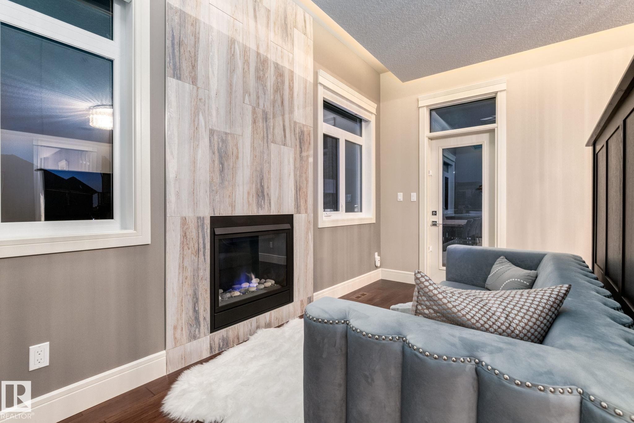 4096 Whispering River Drive Nw, Edmonton, AB - Indoor Photo Showing Living Room With Fireplace