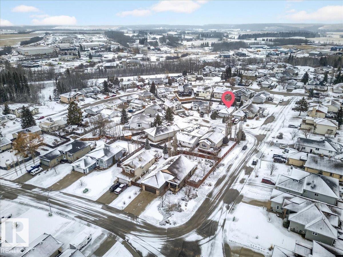 Aerial view of the property and surrounding neighborhood, featuring residential homes with snow-covered roofs and grounds - 4412 Yeoman Close, Onoway, AB - Outdoor With View
