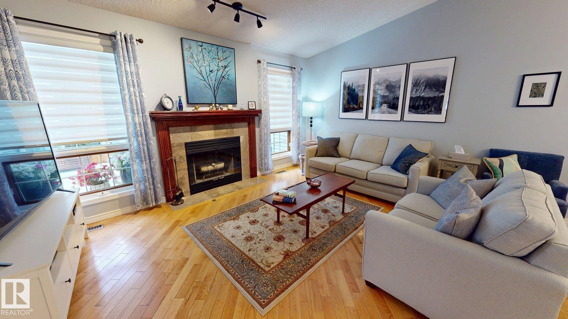 740 Wilkin Close, Edmonton, AB - Indoor Photo Showing Living Room With Fireplace