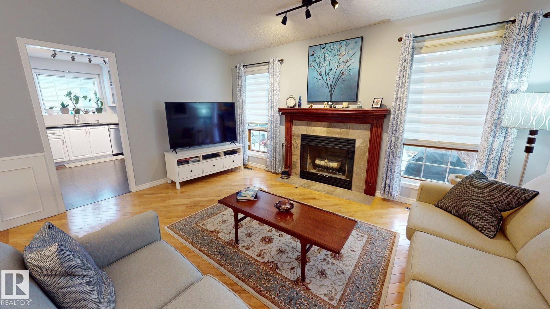 740 Wilkin Close, Edmonton, AB - Indoor Photo Showing Living Room With Fireplace
