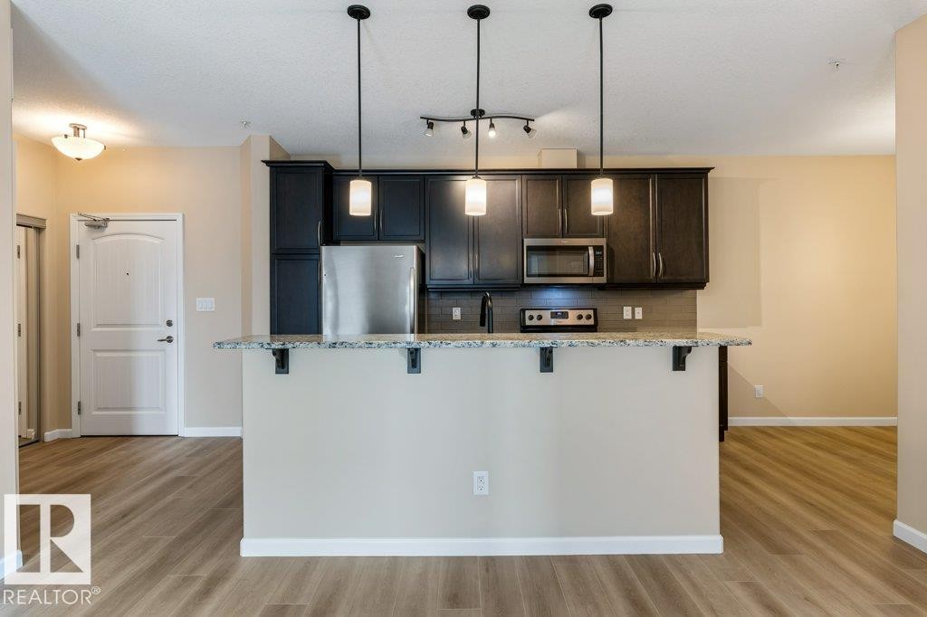 206 6083 Maynard Way, Edmonton, AB - Indoor Photo Showing Kitchen With Upgraded Kitchen