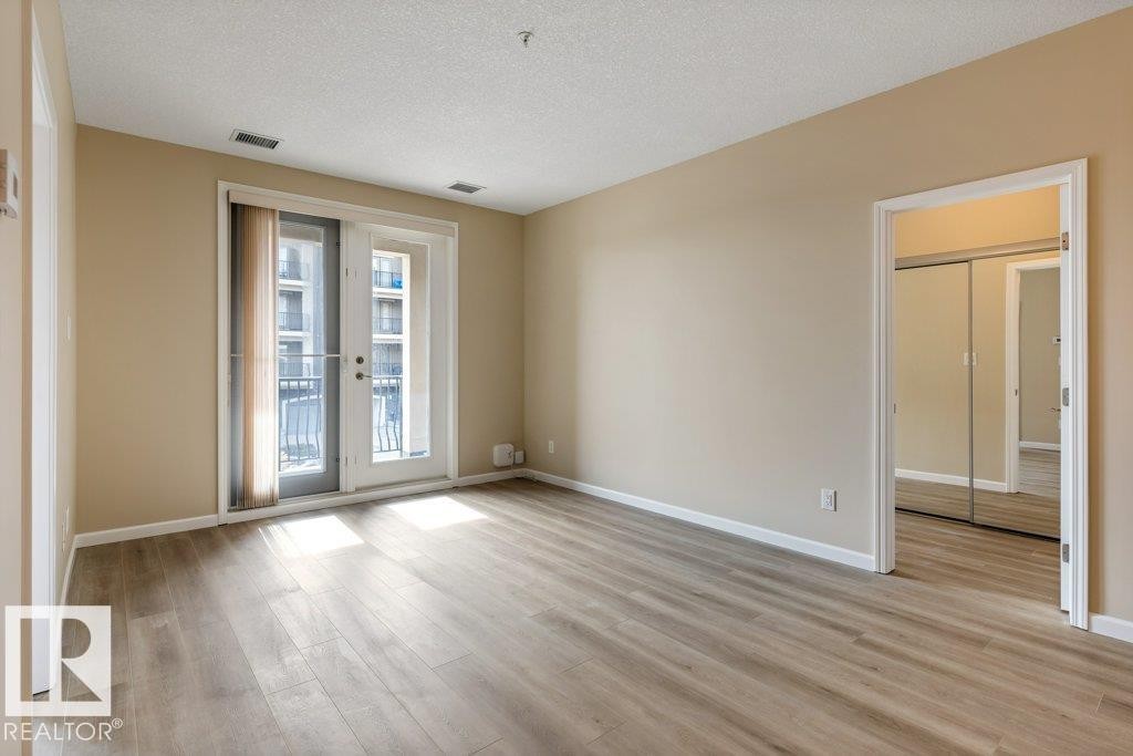 206 6083 Maynard Way, Edmonton, AB - Indoor Photo Showing Other Room