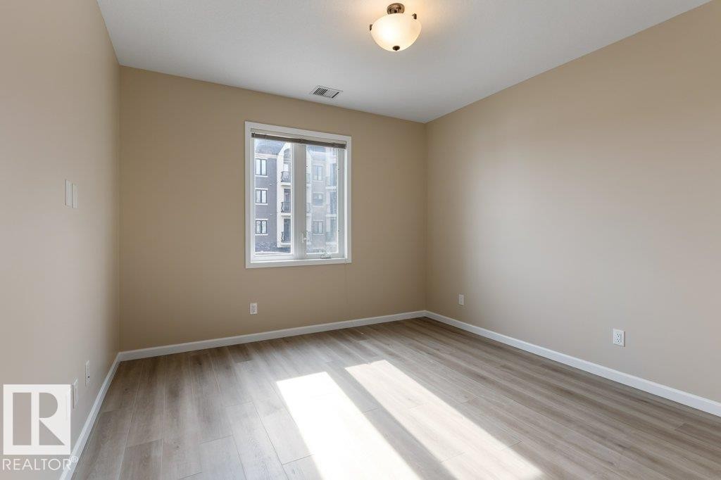 206 6083 Maynard Way, Edmonton, AB - Indoor Photo Showing Other Room