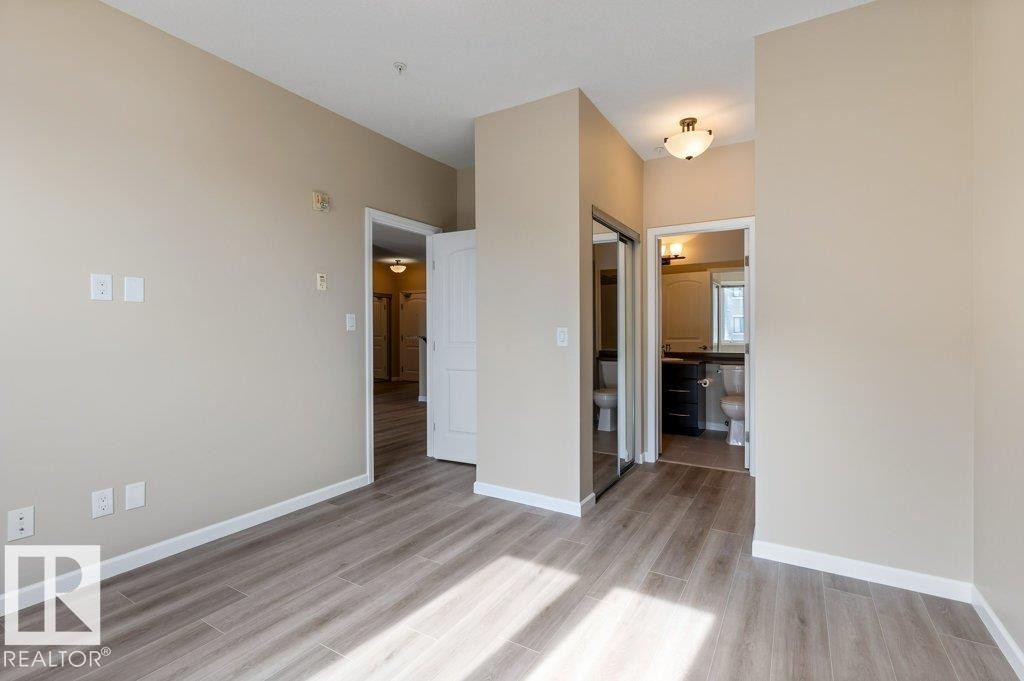 206 6083 Maynard Way, Edmonton, AB - Indoor Photo Showing Other Room