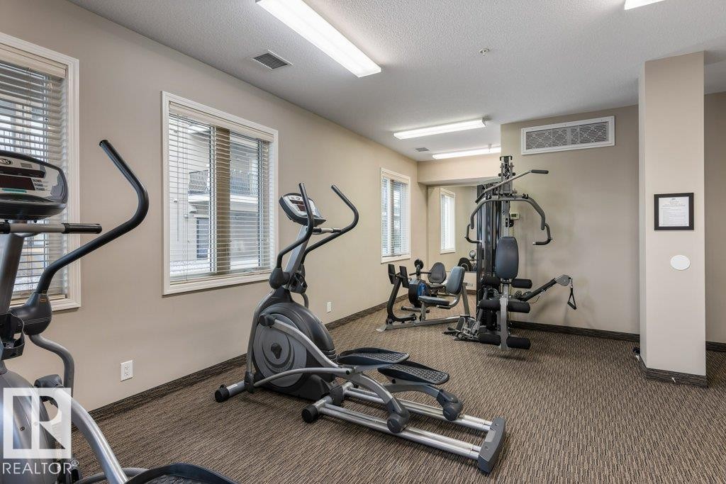 206 6083 Maynard Way, Edmonton, AB - Indoor Photo Showing Gym Room