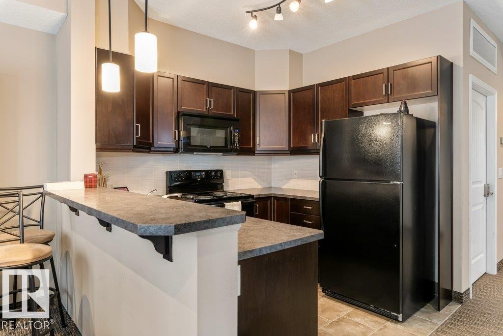 206 6083 Maynard Way, Edmonton, AB - Indoor Photo Showing Kitchen