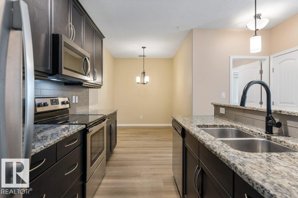 206 6083 Maynard Way, Edmonton, AB - Indoor Photo Showing Kitchen With Double Sink With Upgraded Kitchen