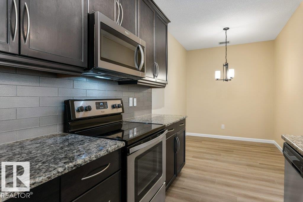 206 6083 Maynard Way, Edmonton, AB - Indoor Photo Showing Kitchen With Stainless Steel Kitchen With Upgraded Kitchen