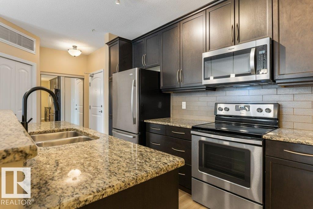 206 6083 Maynard Way, Edmonton, AB - Indoor Photo Showing Kitchen With Stainless Steel Kitchen With Double Sink With Upgraded Kitchen