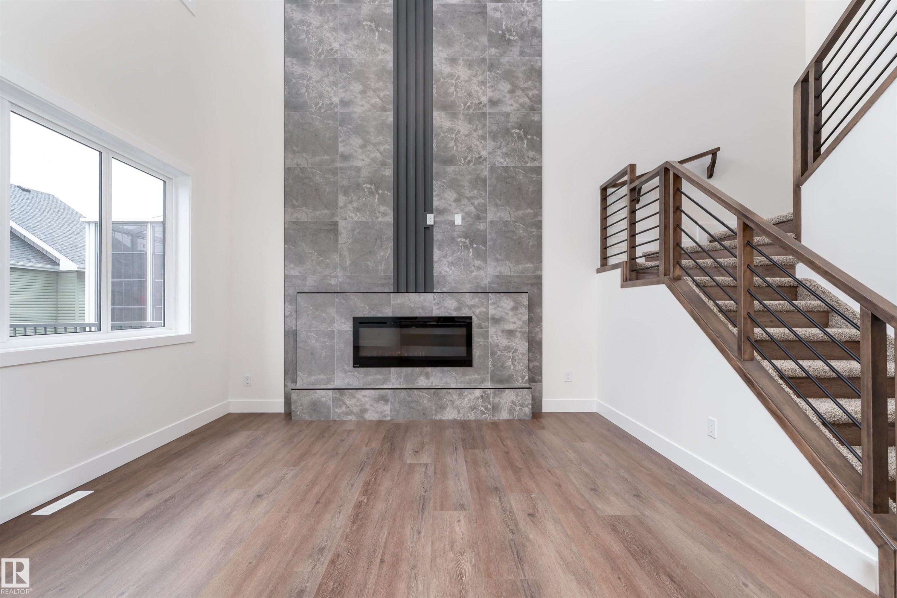 43 Maple Crescent, Gibbons, AB - Indoor Photo Showing Living Room With Fireplace