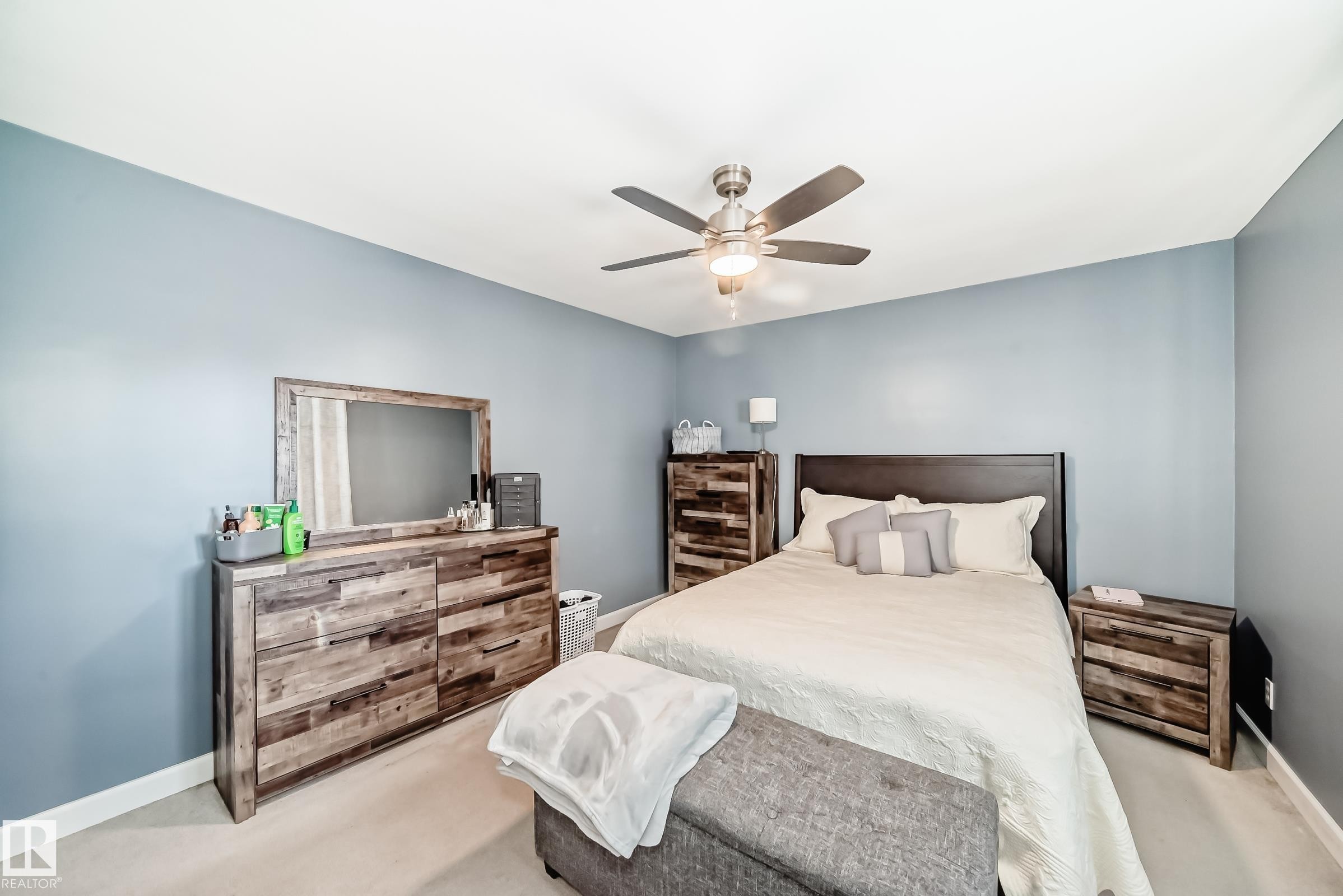 This room features light blue walls, a ceiling fan, and carpeted flooring - 4446 116 Avenue, Edmonton, AB - Indoor Photo Showing Bedroom