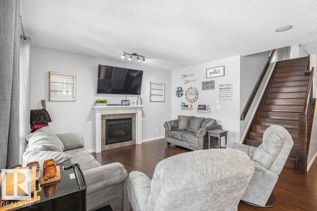 6105 17A Avenue, Edmonton, AB - Indoor Photo Showing Living Room With Fireplace
