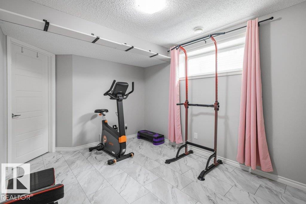 6105 17A Avenue, Edmonton, AB - Indoor Photo Showing Gym Room