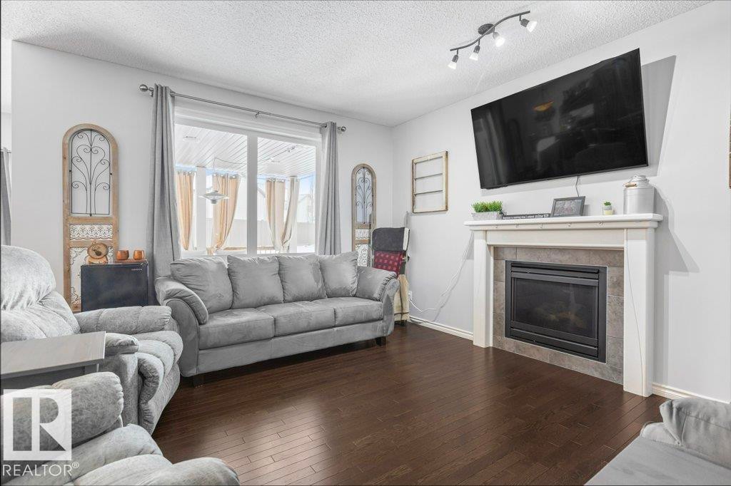 6105 17A Avenue, Edmonton, AB - Indoor Photo Showing Living Room With Fireplace
