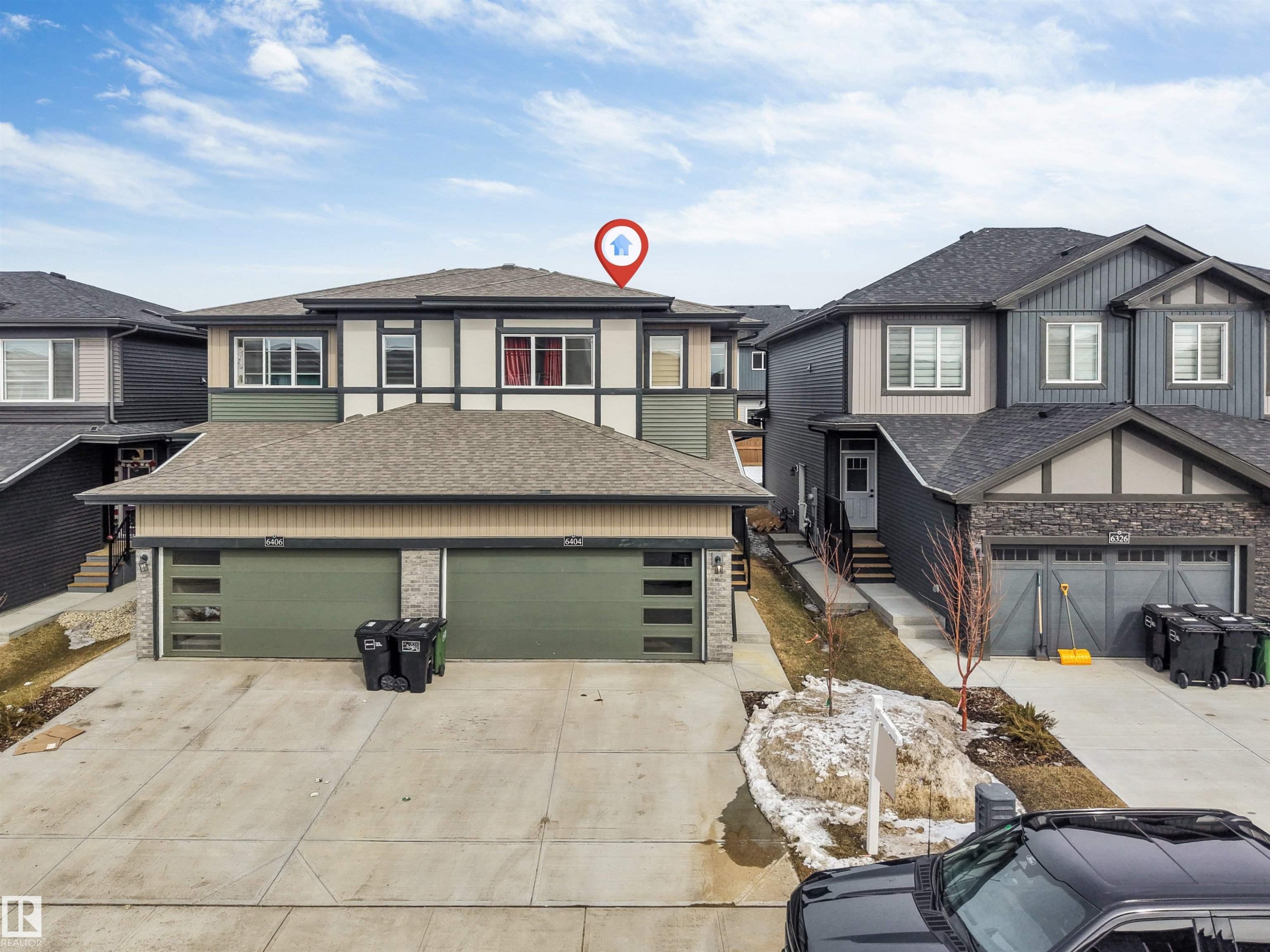 The property features a two-story exterior with a combination of siding and stone accents - 6404 27 Avenue, Edmonton, AB - Outdoor With Facade