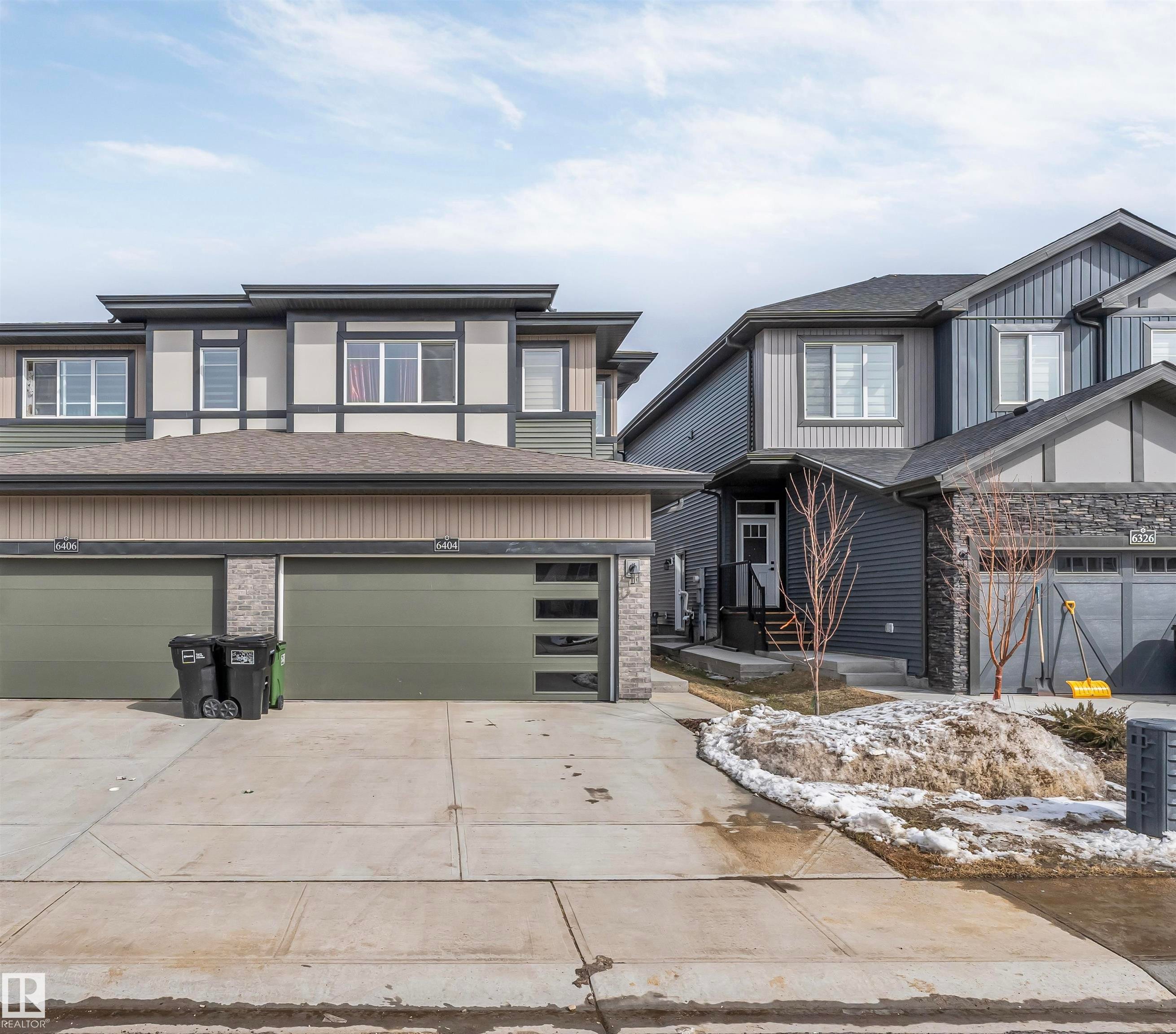 The property features a modern exterior with varied siding textures and a two-car garage - 6404 27 Avenue, Edmonton, AB - Outdoor With Facade