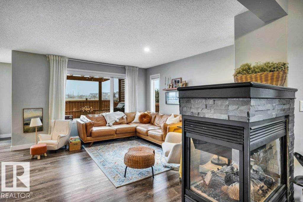 4337 Mcmullen Way, Edmonton, AB - Indoor Photo Showing Living Room With Fireplace