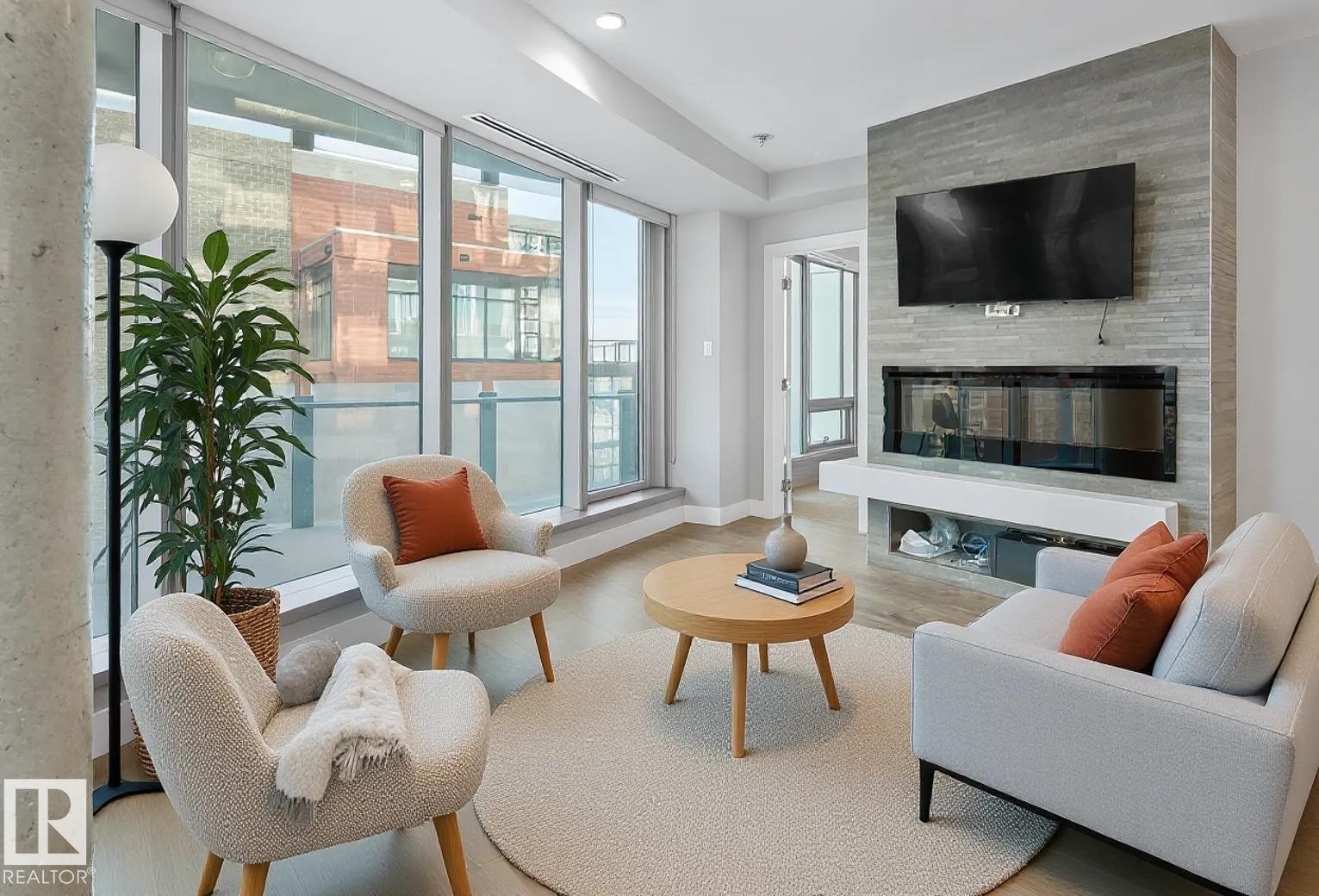 502 11969 Jasper Avenue, Edmonton, AB - Indoor Photo Showing Living Room With Fireplace
