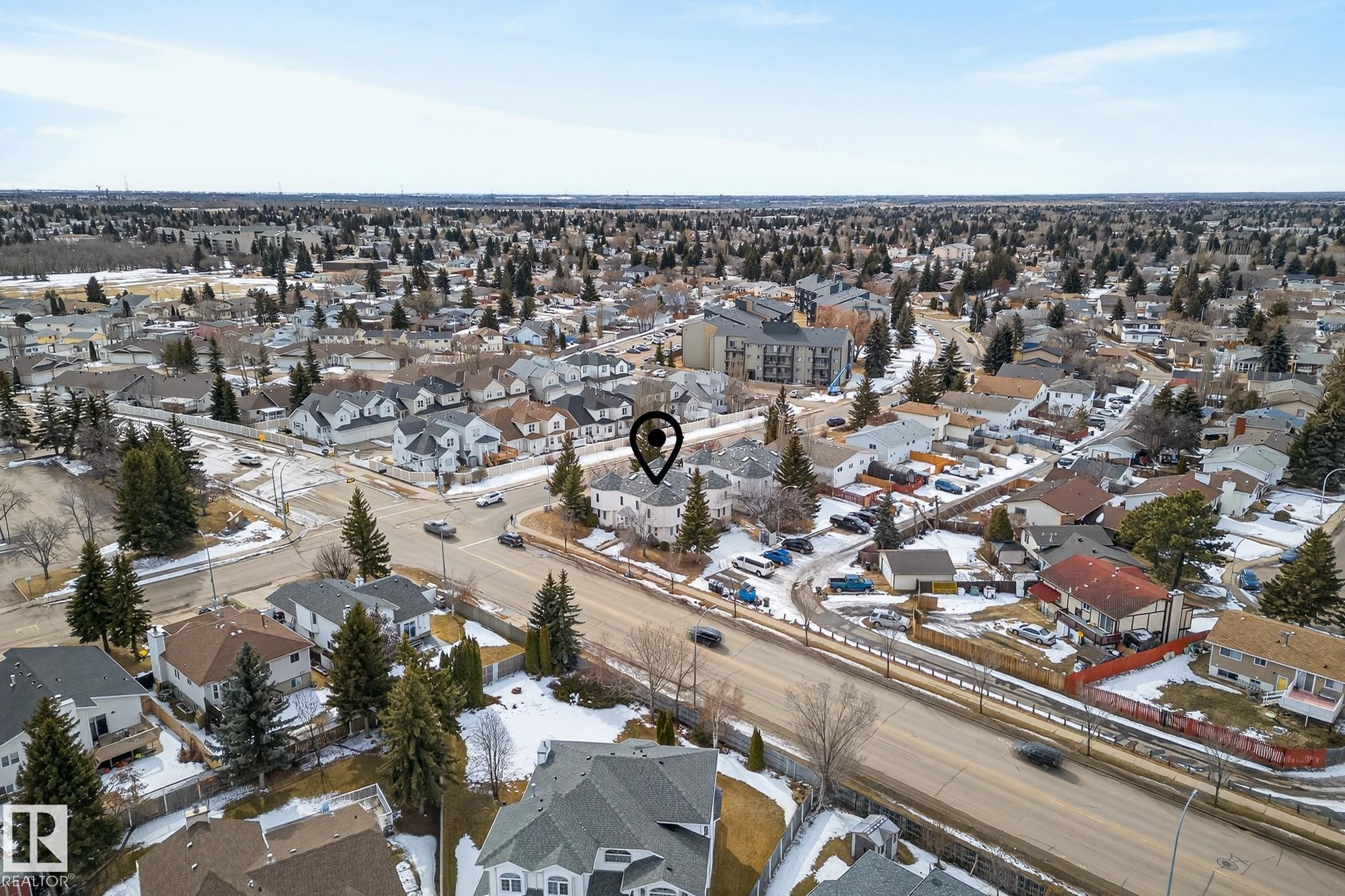 Aerial view of a residential neighborhood with a mix of detached properties and apartment buildings - 2006 Mill Woods Road E, Edmonton, AB - Outdoor With View
