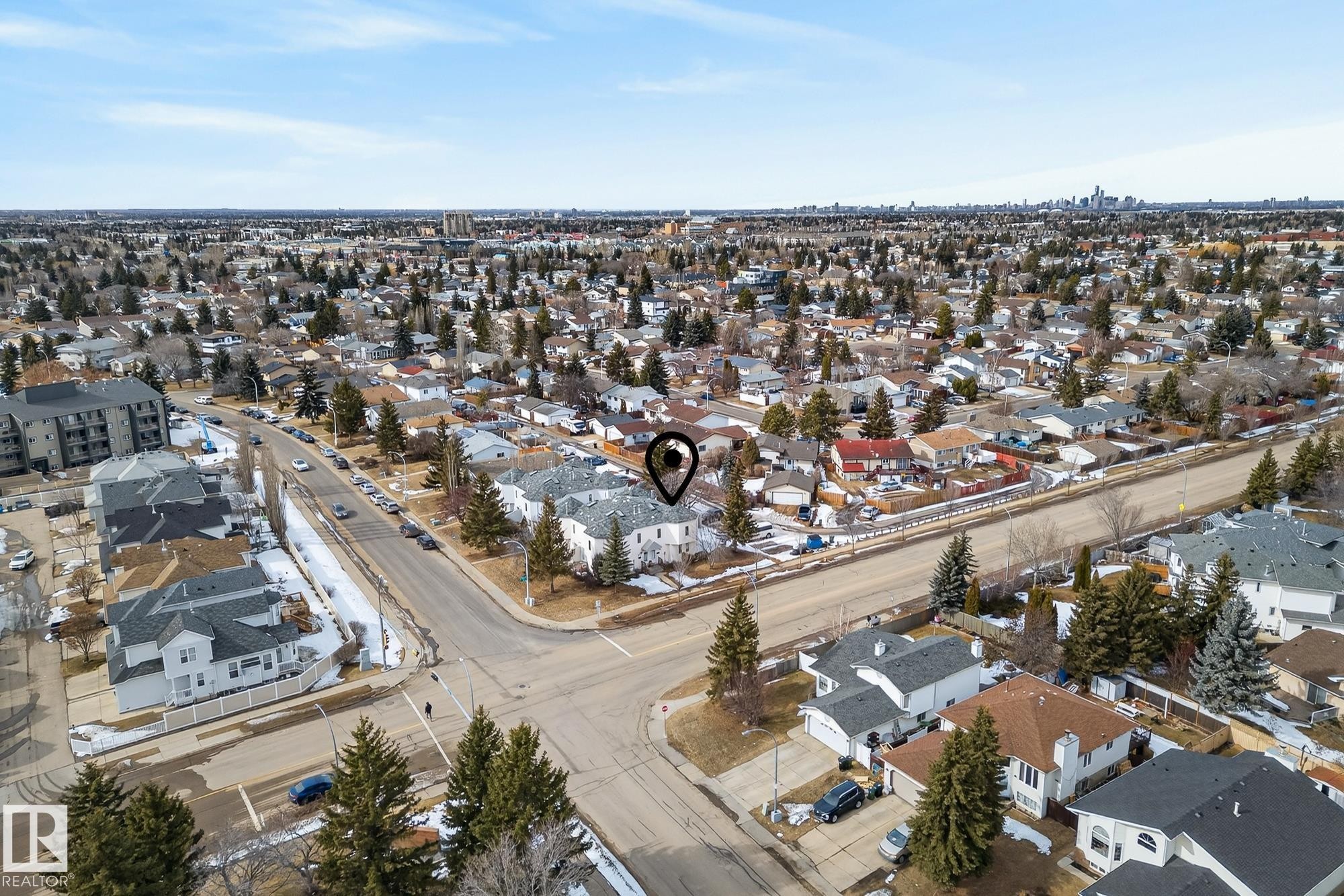 Aerial view showcasing the property's location within a residential neighborhood featuring established trees - 2006 Mill Woods Road E, Edmonton, AB - Outdoor With View