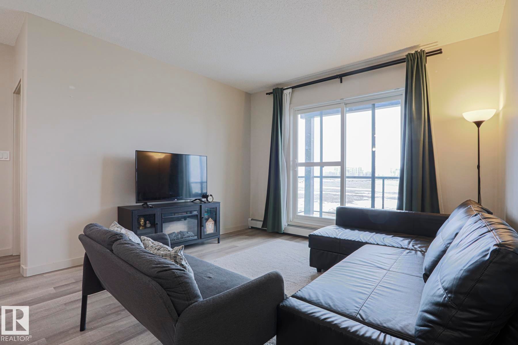 212 320 Ambleside Link, Edmonton, AB - Indoor Photo Showing Living Room