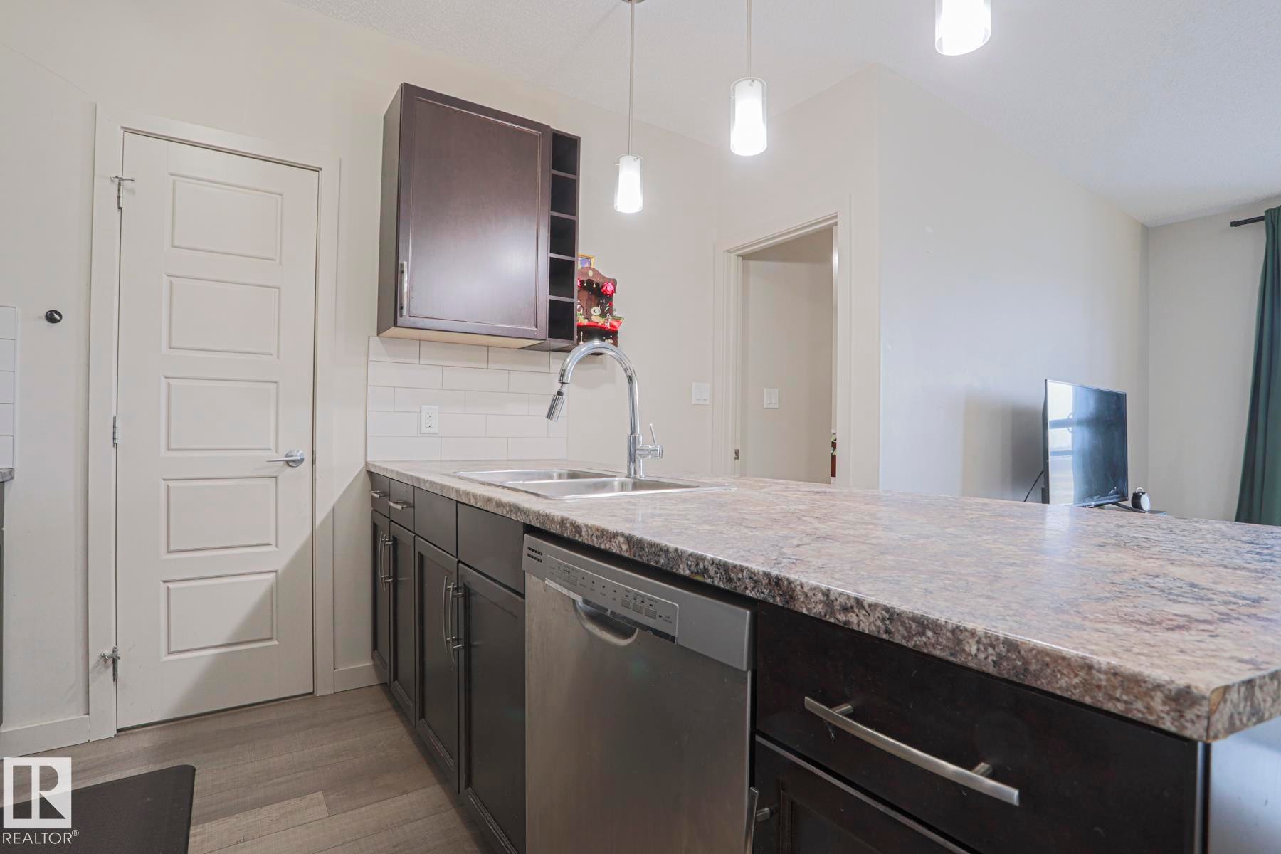 212 320 Ambleside Link, Edmonton, AB - Indoor Photo Showing Kitchen With Double Sink
