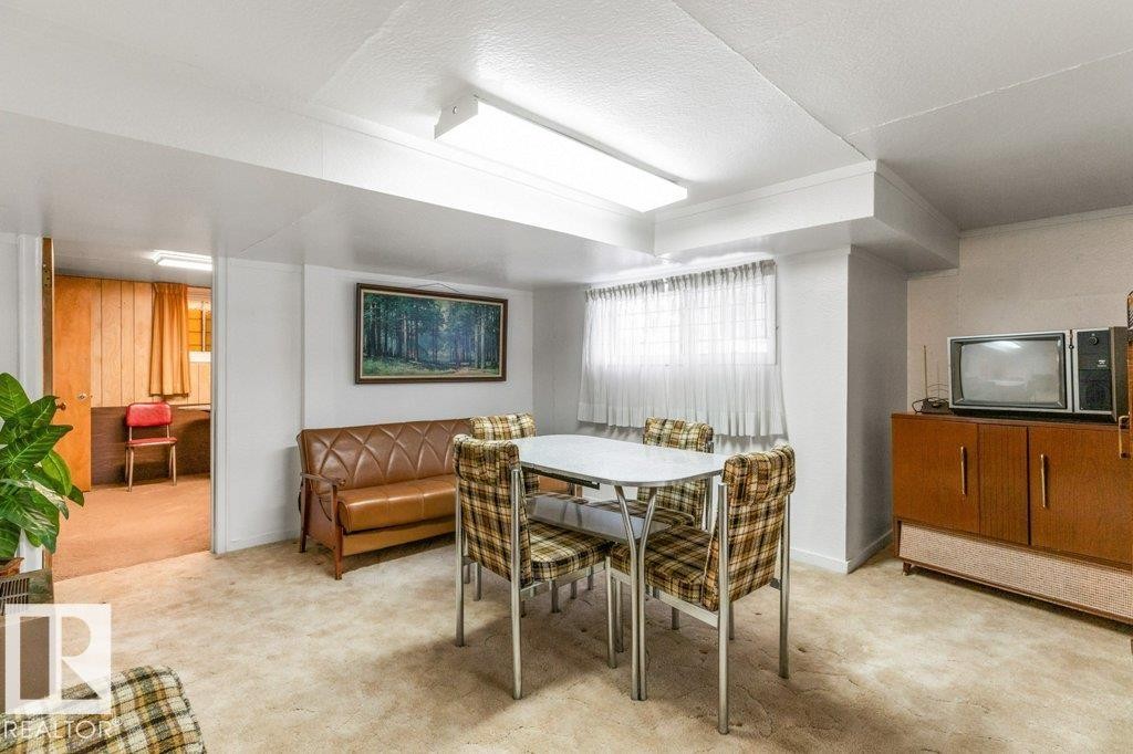 Dining room featuring light carpet - 8810 93 Street, Edmonton, AB - Indoor Photo Showing Dining Room