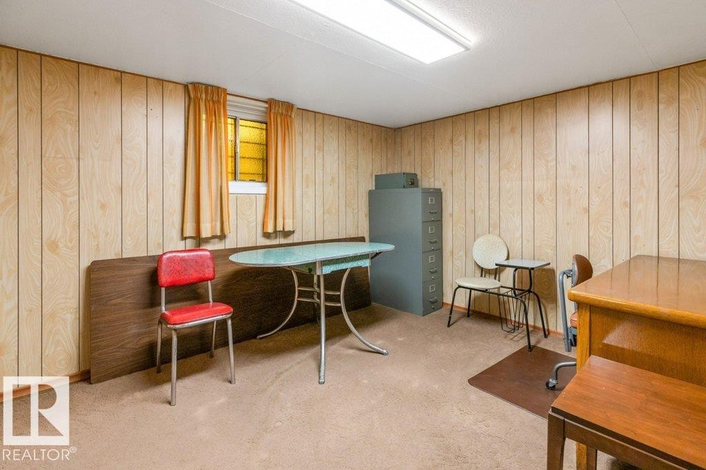 Miscellaneous room featuring carpet floors and wooden walls - 8810 93 Street, Edmonton, AB - Indoor Photo Showing Other Room