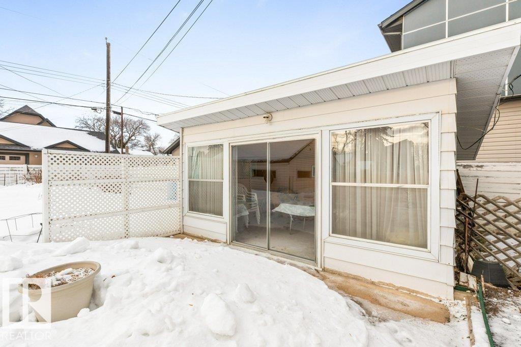 View of snow covered patio - 8810 93 Street, Edmonton, AB - Outdoor With Exterior