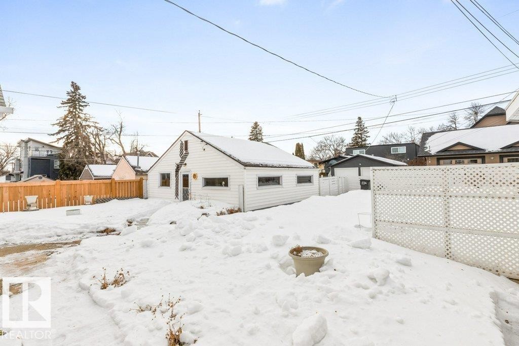 Back of house featuring an outdoor structure and a residential view - 8810 93 Street, Edmonton, AB - Outdoor