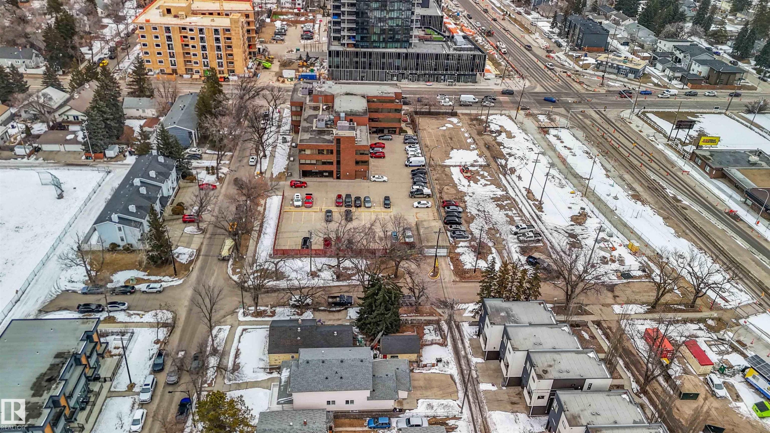 This aerial view showcases the property's advantageous location within a developed area, surrounded by various residential and commercial structures - 10186 143 Street, Edmonton, AB - Outdoor With View