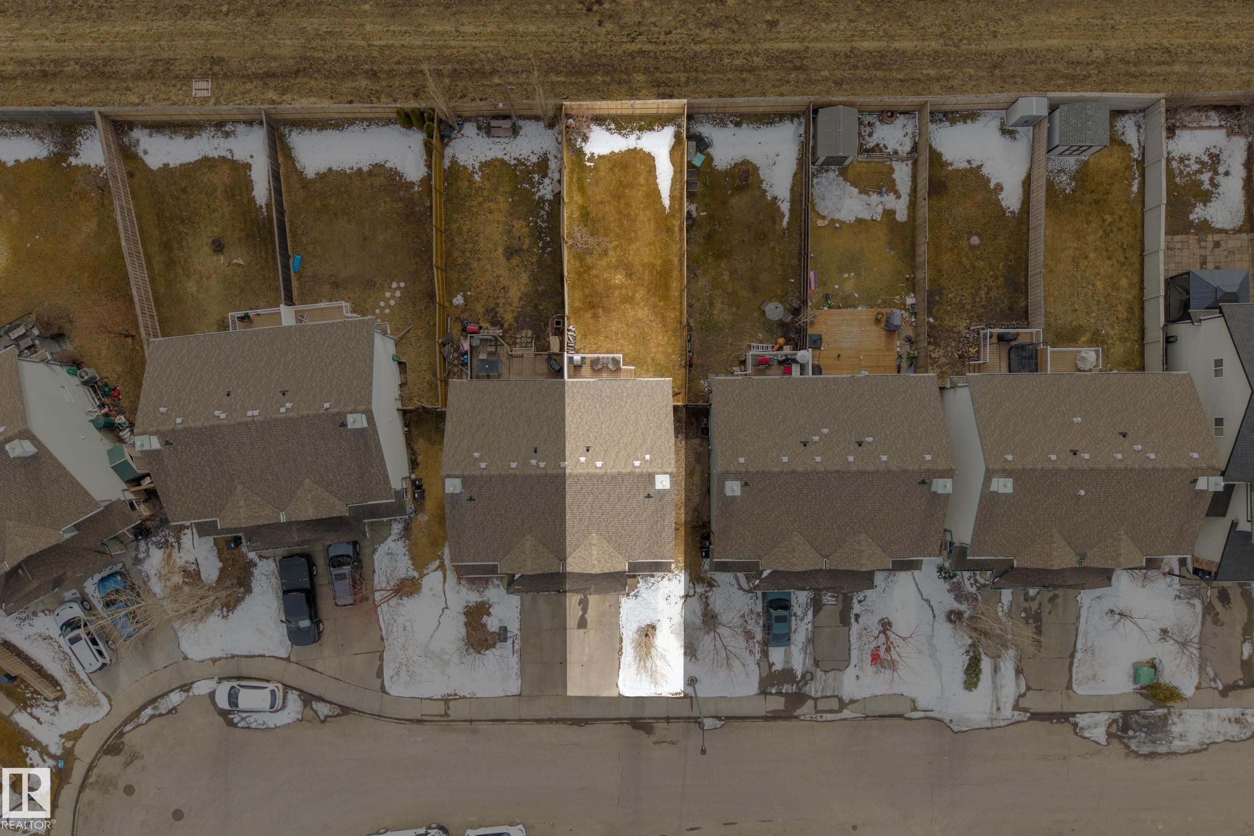 Aerial view of the property with a brown shingled roof and a paved driveway - 9051 Scott Crescent, Edmonton, AB