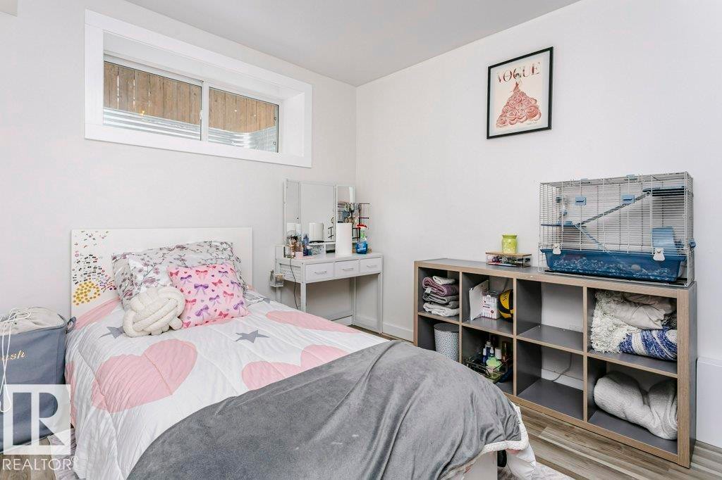 This room features light-colored walls and flooring, with a window providing natural light - 320 Balsam Link, Leduc, AB - Indoor Photo Showing Bedroom