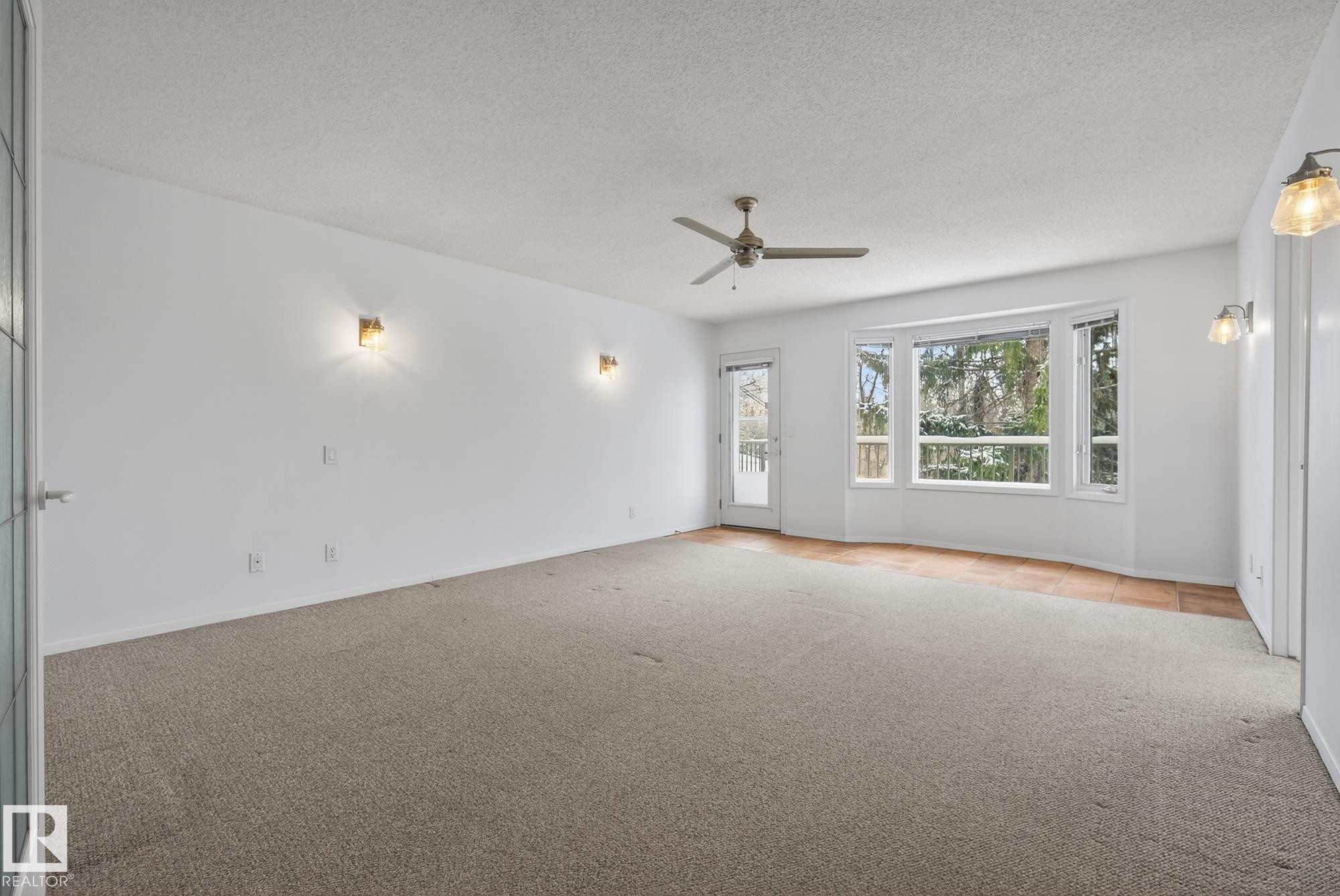 With Garden Doors to Deck - 9115 77 Avenue, Edmonton, AB - Indoor Photo Showing Other Room
