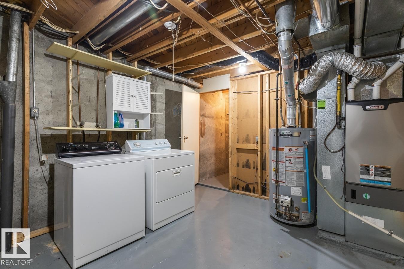 This area of the property includes laundry appliances, a water heater, and a furnace - 242 Primrose Gardens, Edmonton, AB - Indoor