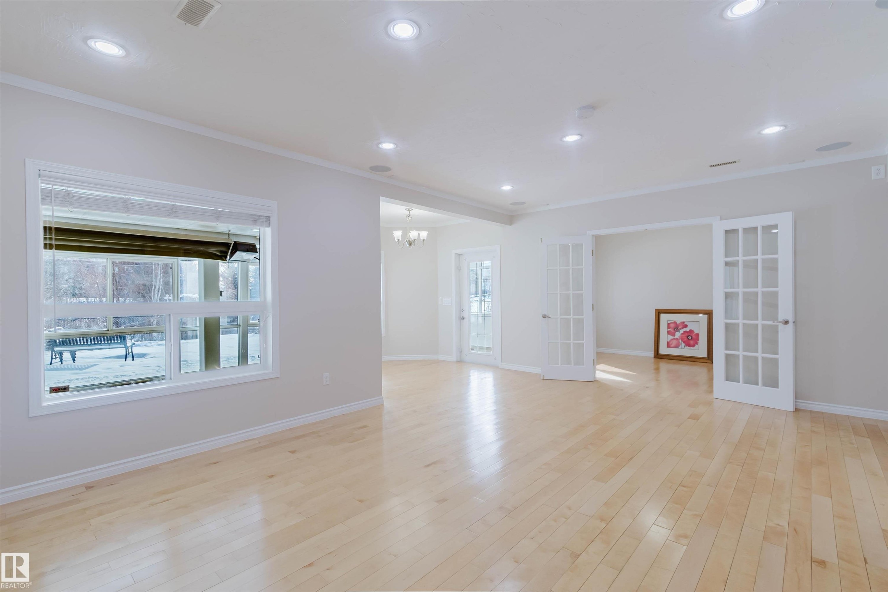 Bright and spacious room featuring light-colored hardwood flooring, recessed lighting, and white trim - 1135 112 Street, Edmonton, AB - Indoor Photo Showing Other Room