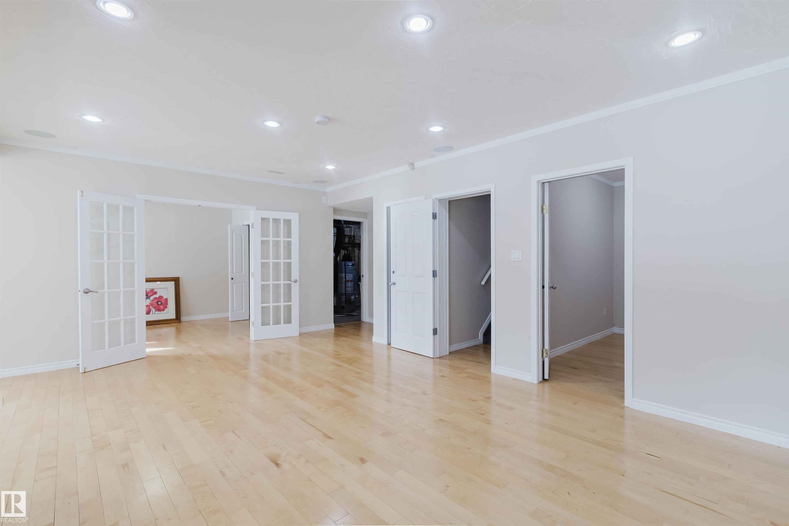 Spacious interior featuring light hardwood flooring, recessed lighting, and white trim - 1135 112 Street, Edmonton, AB - Indoor Photo Showing Other Room