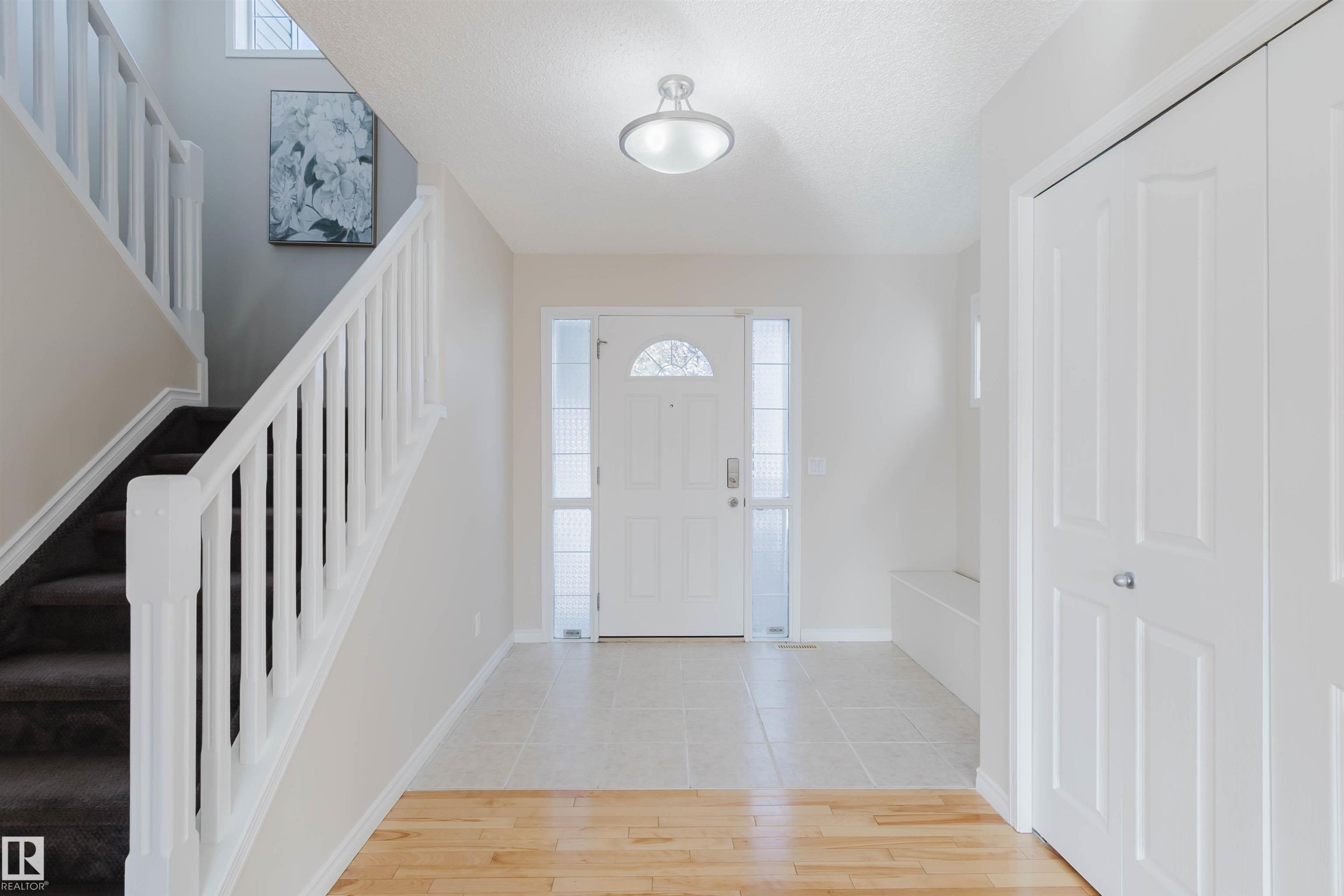 The property features a bright entryway with a white front door, sidelight windows, and a overhead light fixture - 1135 112 Street, Edmonton, AB - Indoor Photo Showing Other Room