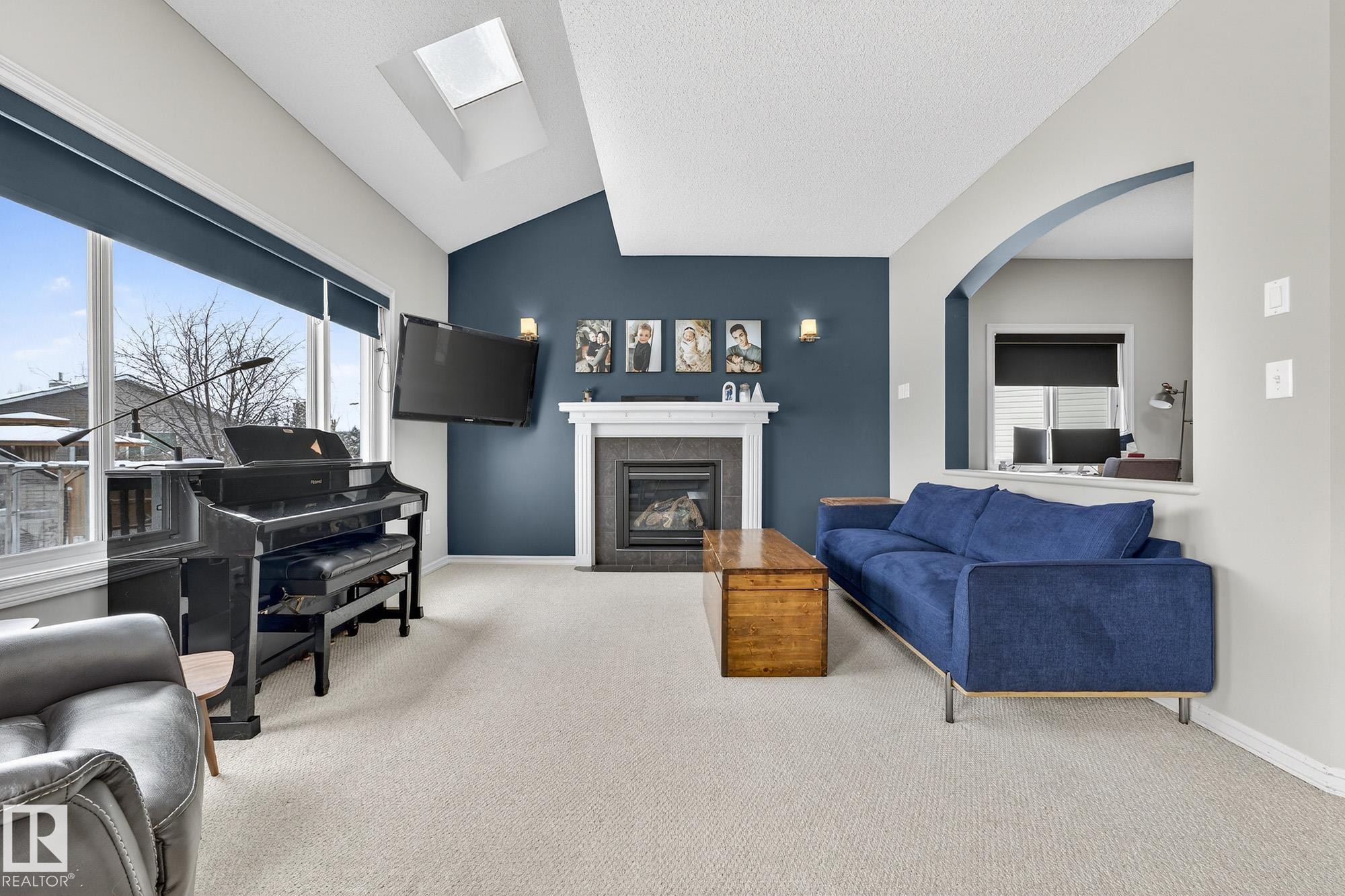 112 Windrose Drive, Leduc, AB - Indoor Photo Showing Living Room With Fireplace
