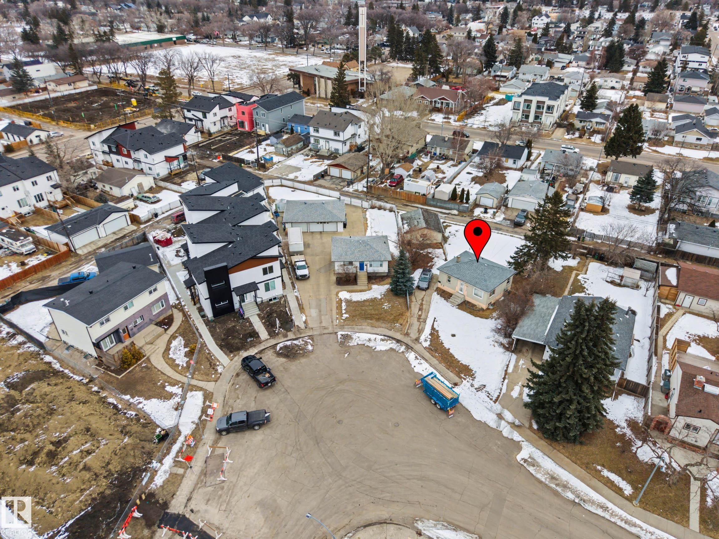 Aerial view showcasing the property within the neighborhood, highlighting its position among other residential structures and nearby open spaces - 9409 154 Street, Edmonton, AB - Outdoor With View